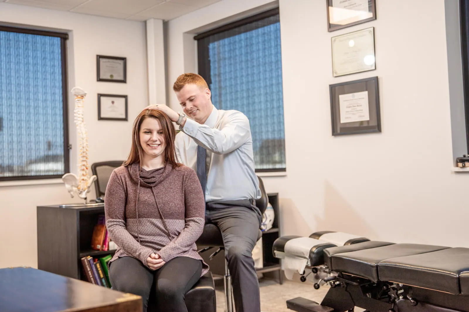 Dr. Andrew Jahner examining a patient's back pain