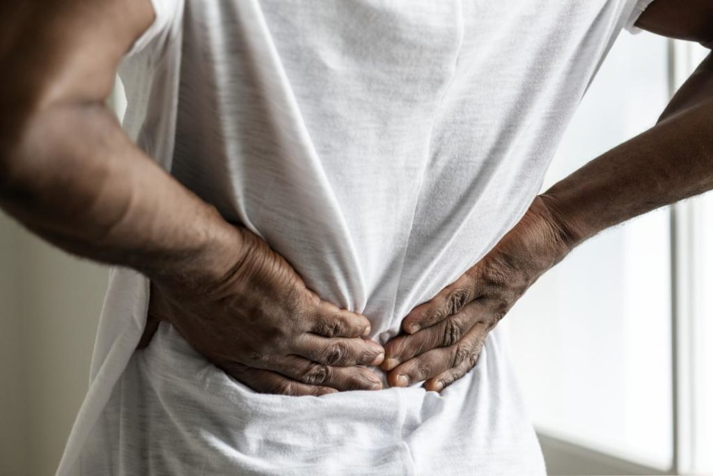 Person Experiencing Lower Back Pain - Chiropractic Care