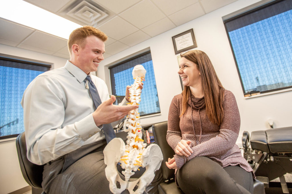 Dr. Nicholas Barney working with female patient