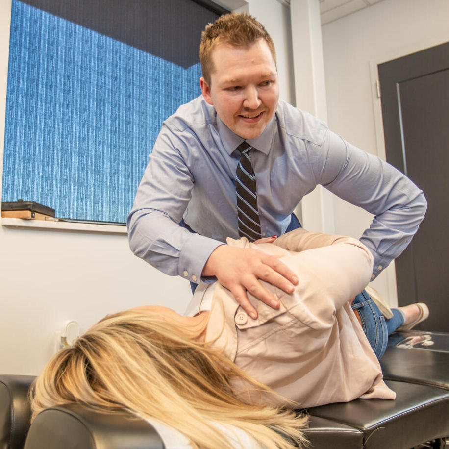 Dr. Nicholas Barney attend to patients hip pain treatment